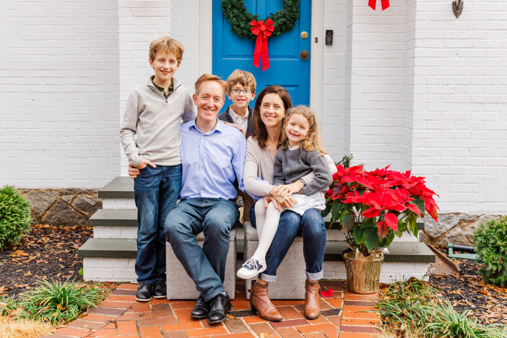 Christmas Family picture sitting in front of house front porch in Atlanta GA