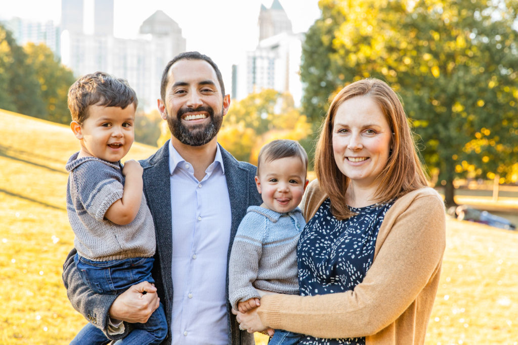 family portraits during golden hour in Atlanta GA in front of the skyline in piedmont part midtown by Laure Photography