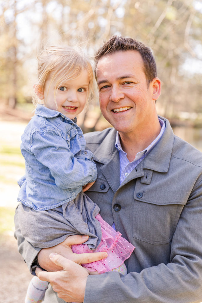 daddy holding his daughter during family photo session with Laure Photography Atlanta