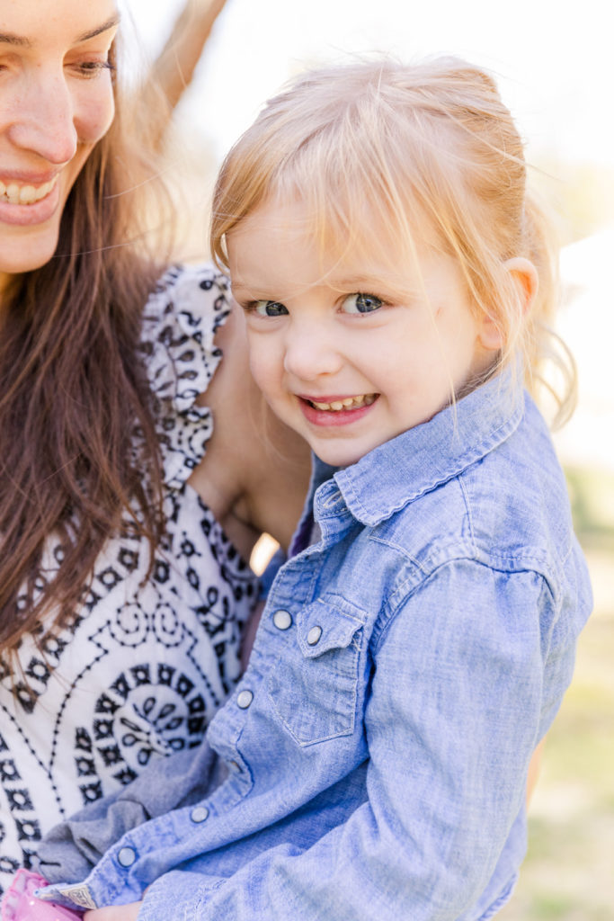 lifestyle toddler daughter on mommy arms during family photoshoot Laure Photography Atlanta