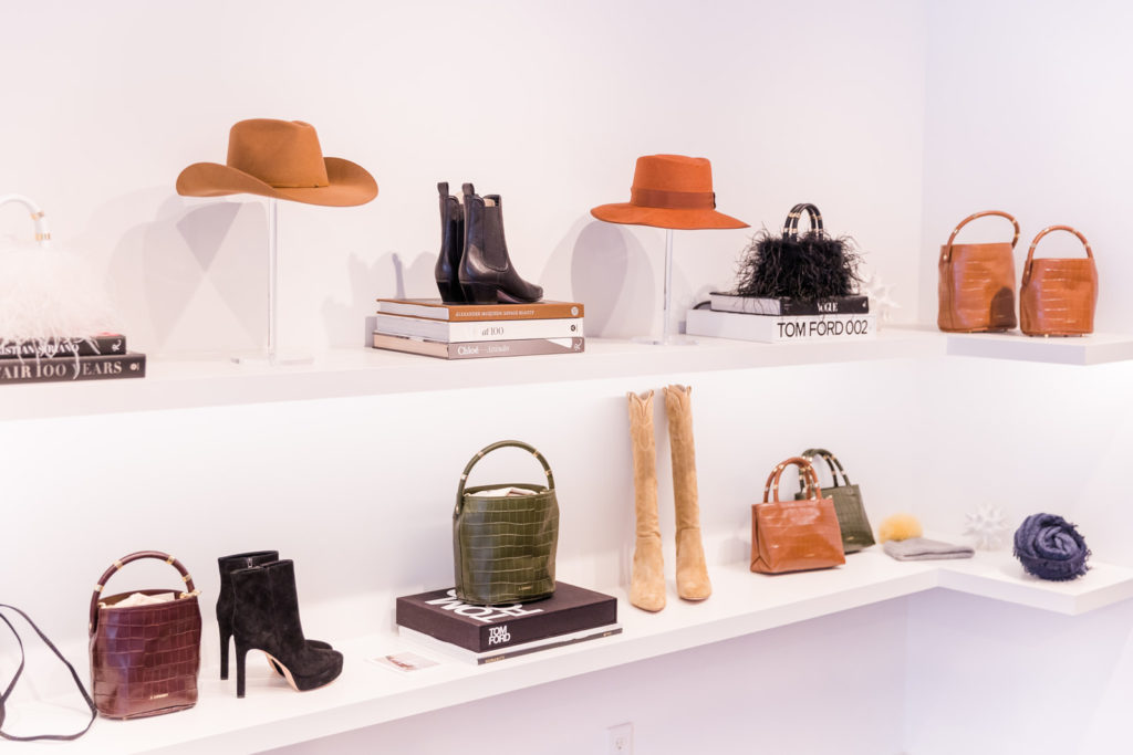 display of fashion accessories books, hats, shoes and purses in Tulipano Atlanta by Laure Photography branding