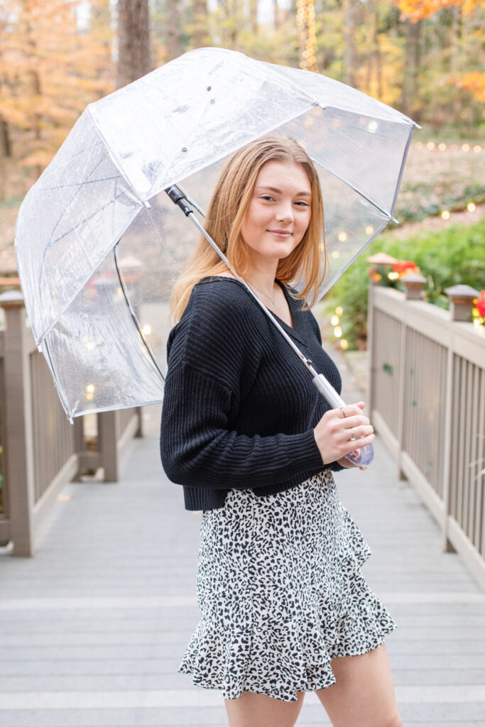 Girl teenager Atlanta high school senior photo session under a transparent umbrella by Laure Photography