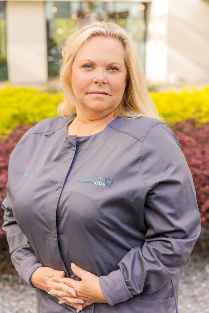 Headshots of Atlanta dentist office team in building courtyard by brand photographer Laure photography