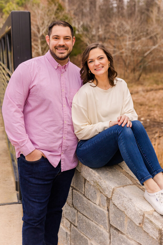 Couple standing at the entrance of a park bridge during a family photo session by Atlanta family photographer Laure Photography