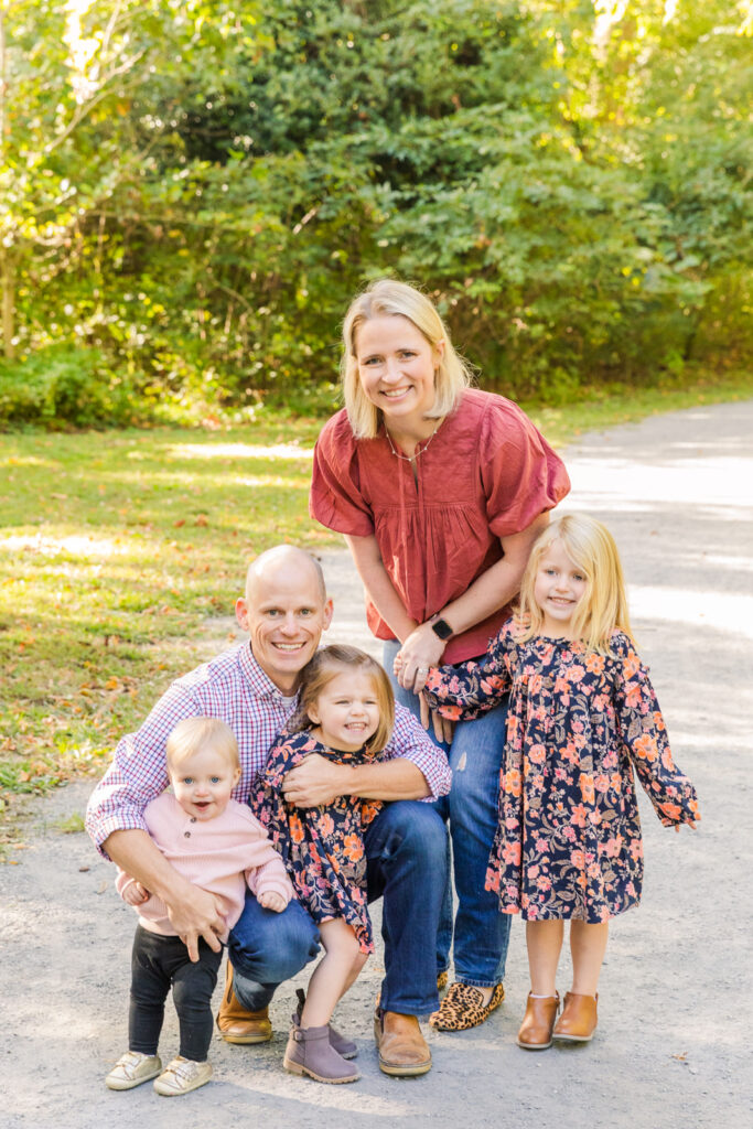 family with 3 toddlers standing on a path during fall mini session with Atlanta family photographer Laure Photography