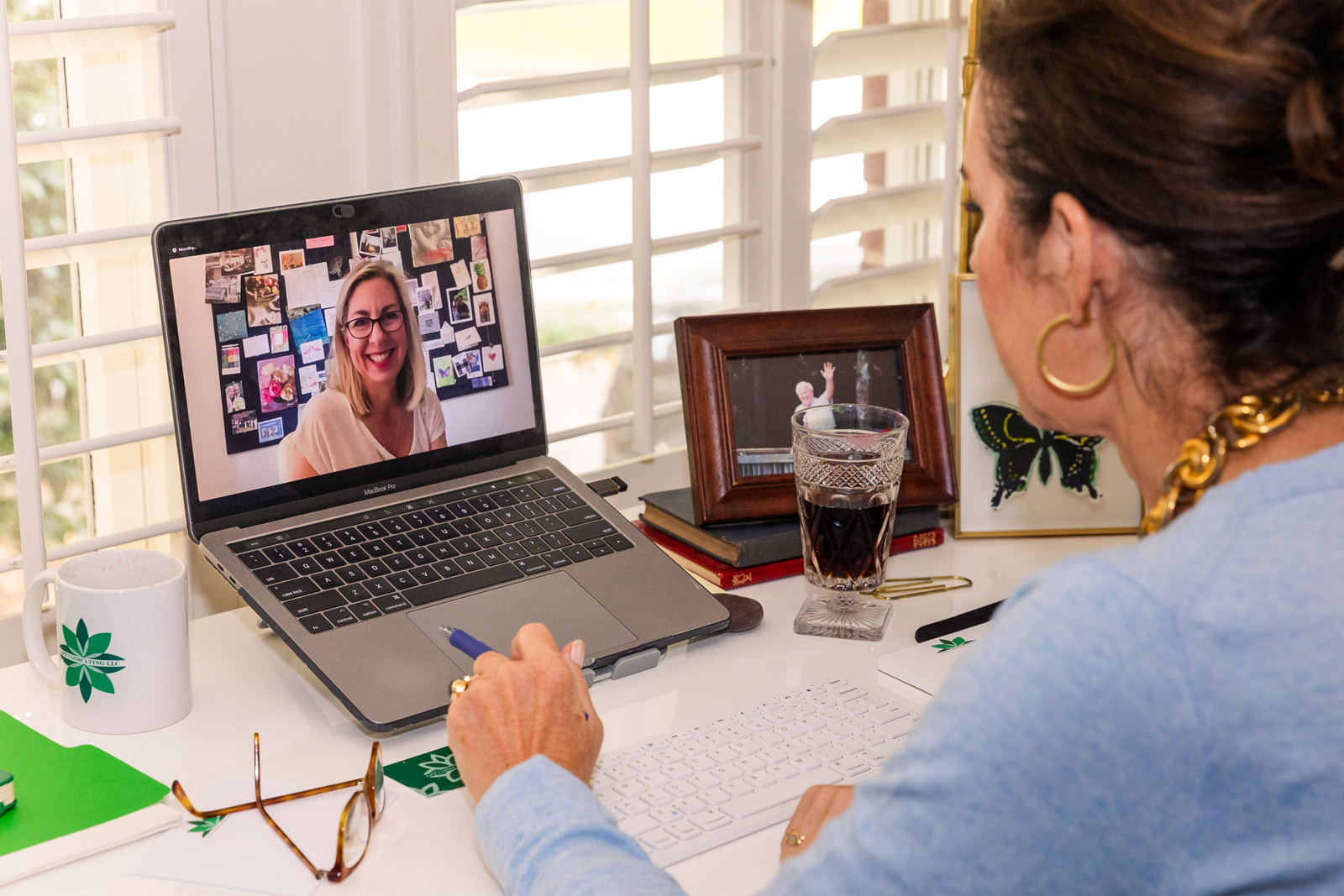 woman un home office during a zoom consultation with a client during brand photo shoot Atlanta with Laure Photography