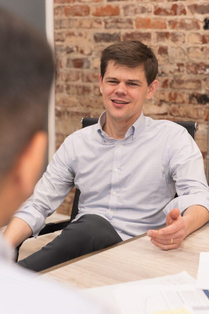 Professionals discussing business during a conference room meeting in Atlanta