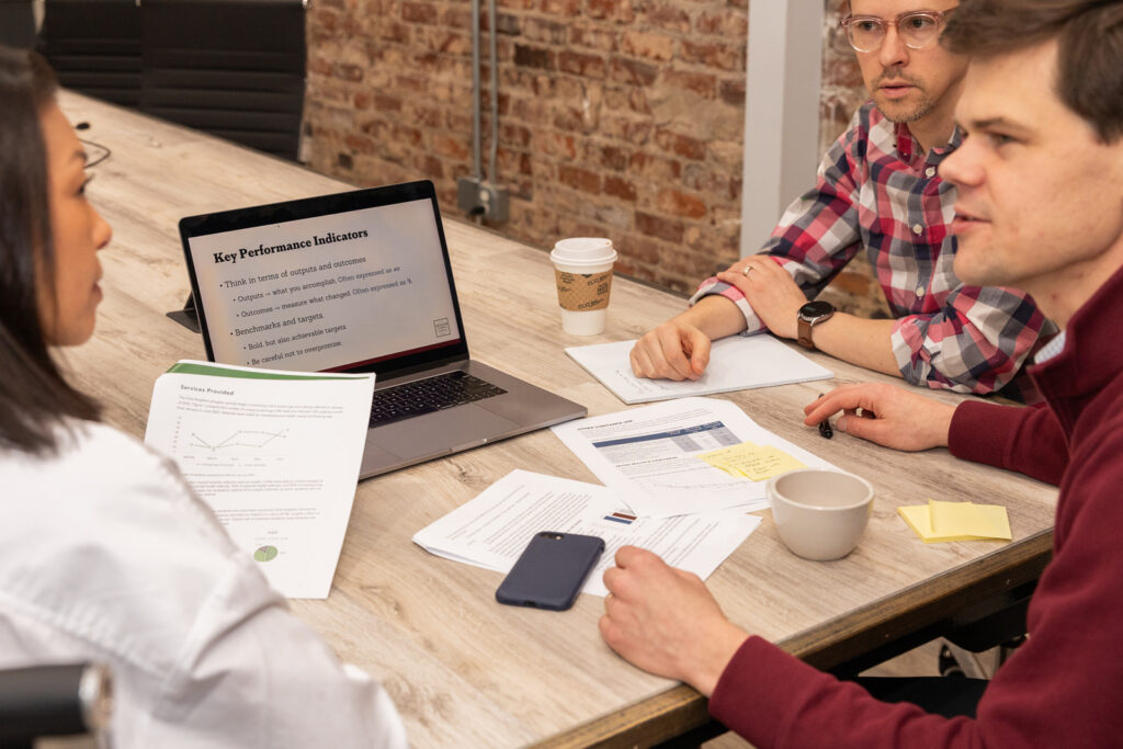 Detail of laptop screen showing documents and presentation during business meeting in Atlanta