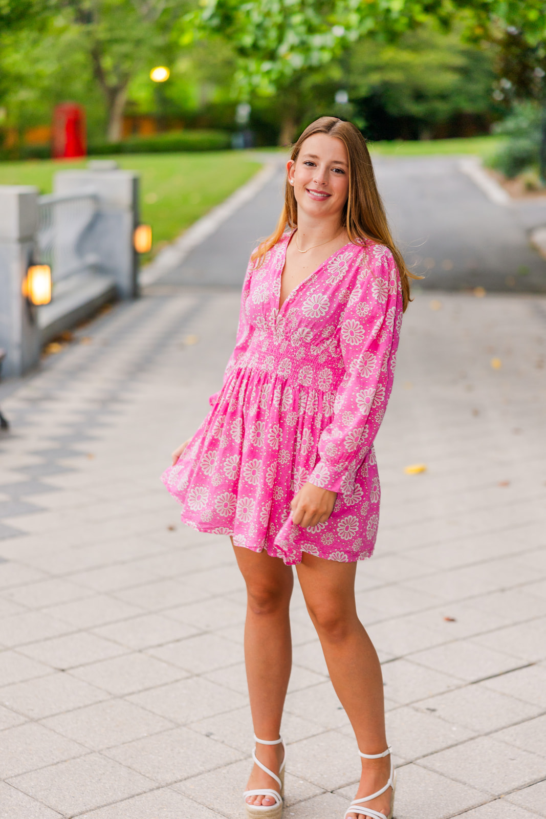 teenager twirling in summer dress during senior portraits in Atlanta Park