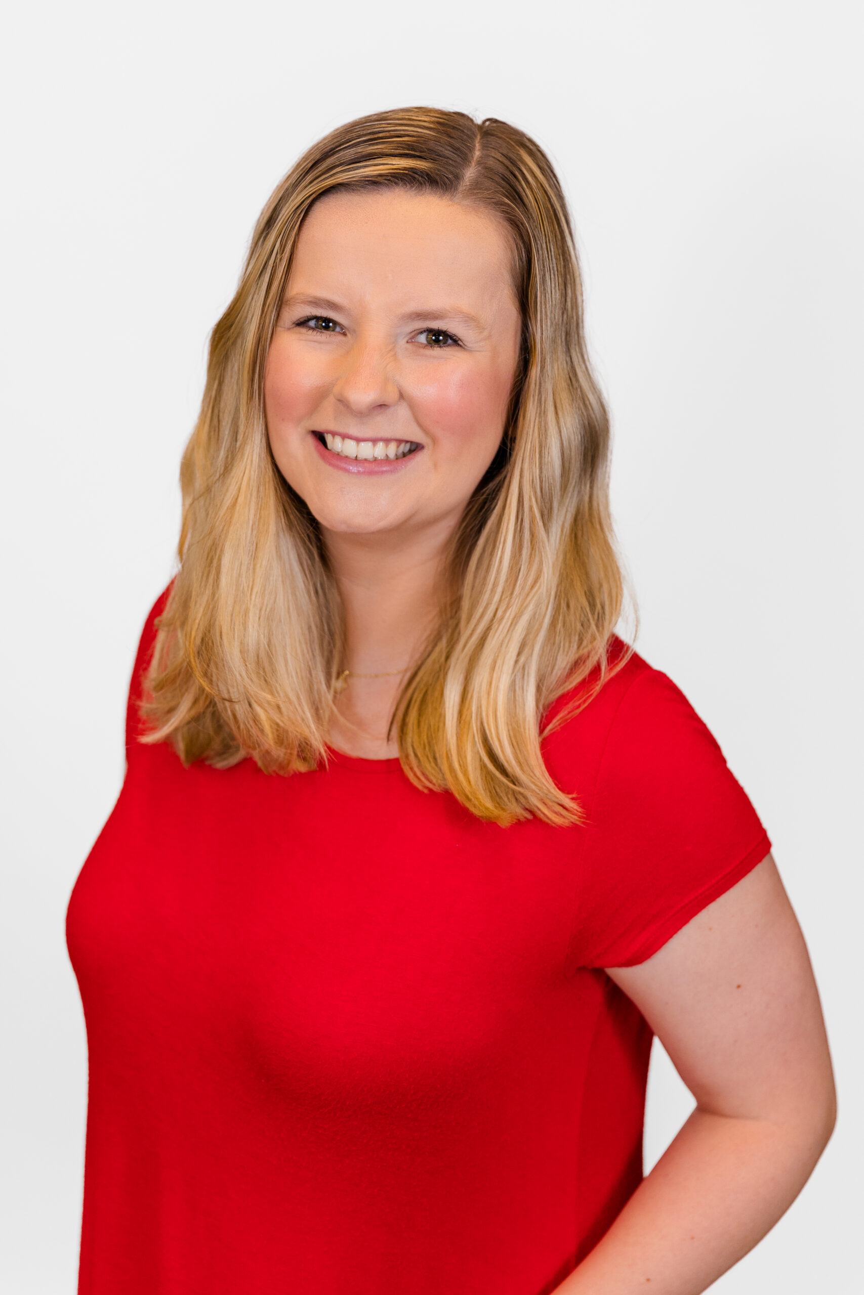 Sydney Jameson wearing red dress during corporate headshot mini session in Atlanta by photographer Laure Photography