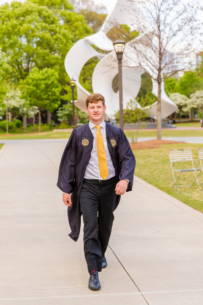 Jason walking modern sculpture | Graduation Portraits | Georgia Tech University | Atlanta Senior Photographer | Laure Photography