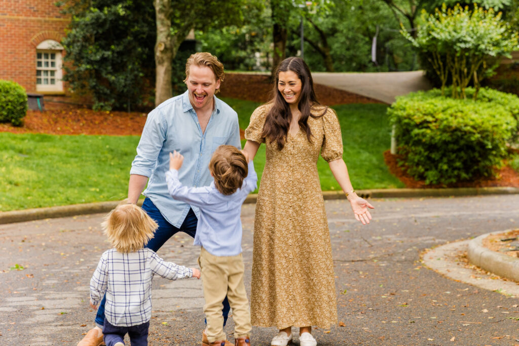 Two brothers run toward parents who wait with open arms.