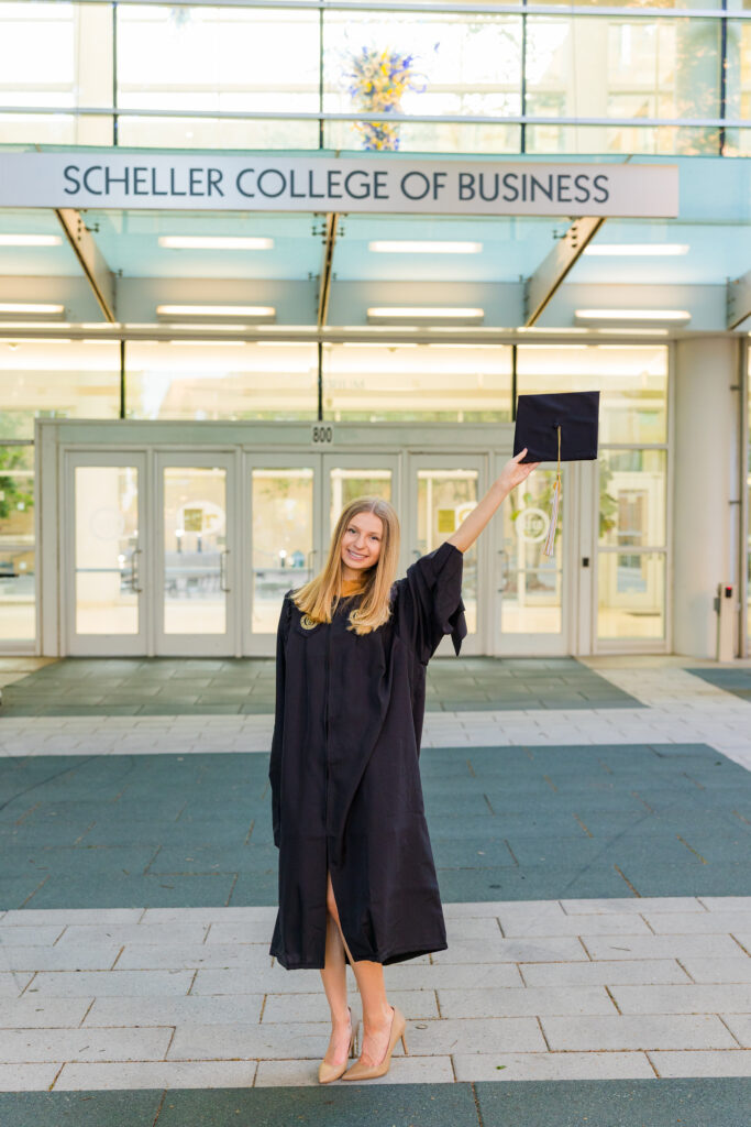 Gabriela posing in front of Scheller College of Business for Georgia Tech graduation photos