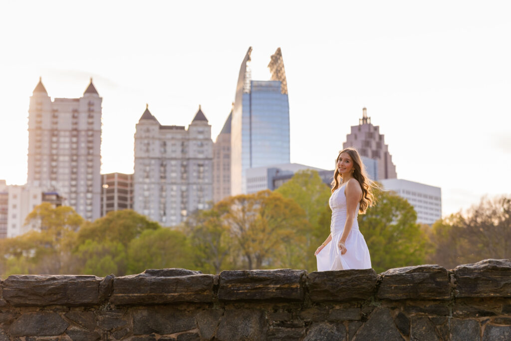 Senior walking with Midtown Atlanta skyline in background