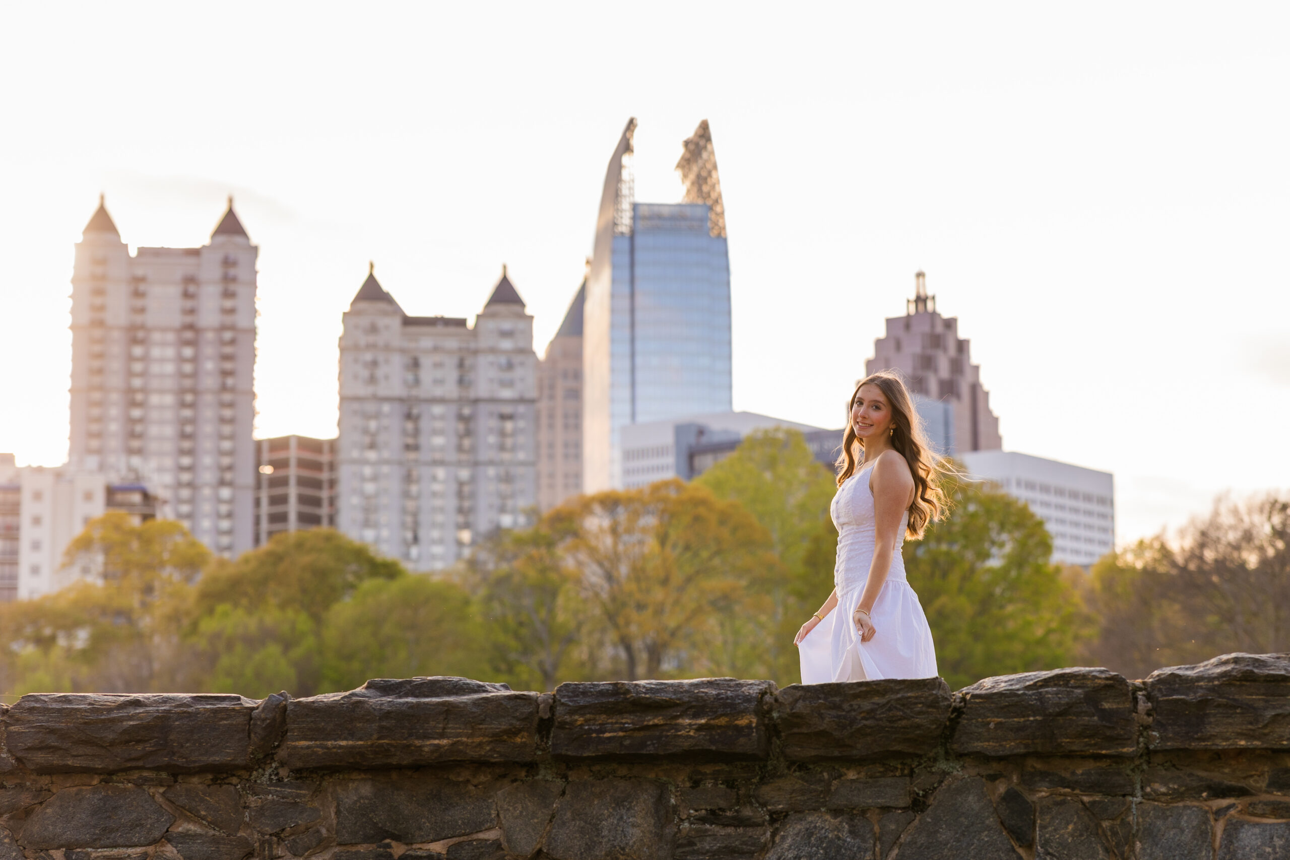 Senior walking with Midtown Atlanta skyline in background