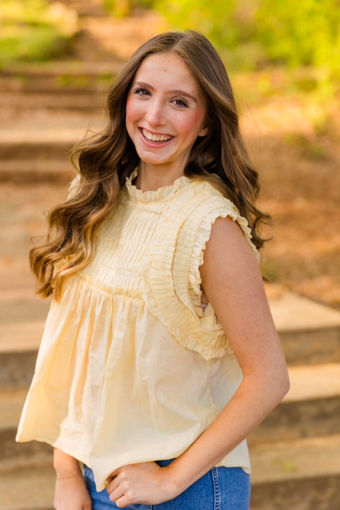 Senior girl laughing candidly during session in Piedmont Park Atlanta
