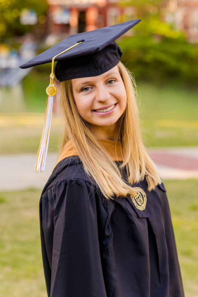 Close-up portrait of Gabriela wearing her graduation cap and tassel at Georgia Tech