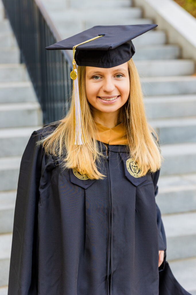 Close-up portrait of Gabriela on the stairs at Georgia Tech