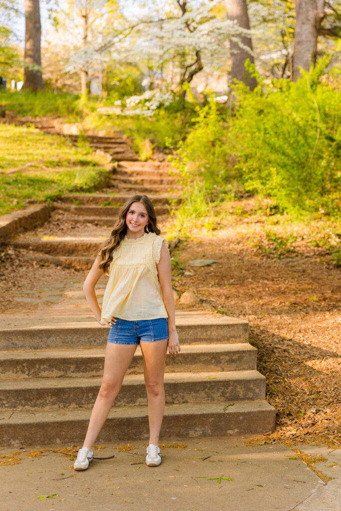 Senior standing in front of stairs in Piedmont Park Atlanta