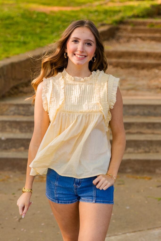 Senior walking confidently during photoshoot in Piedmont Park