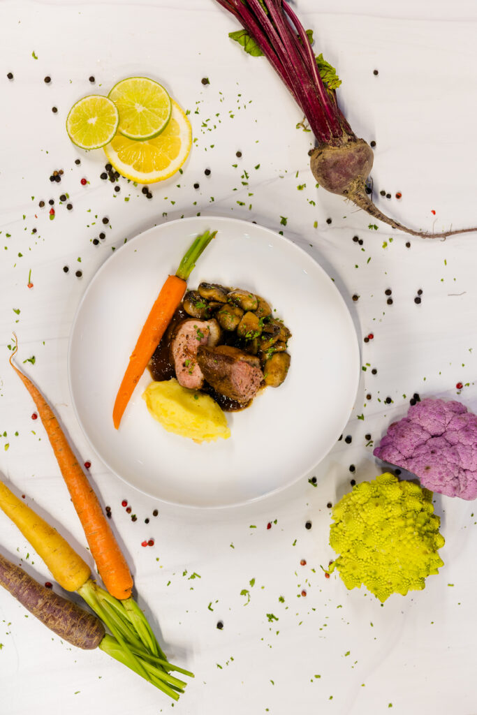 Overhead styled vegetable plate with spices and ingredients