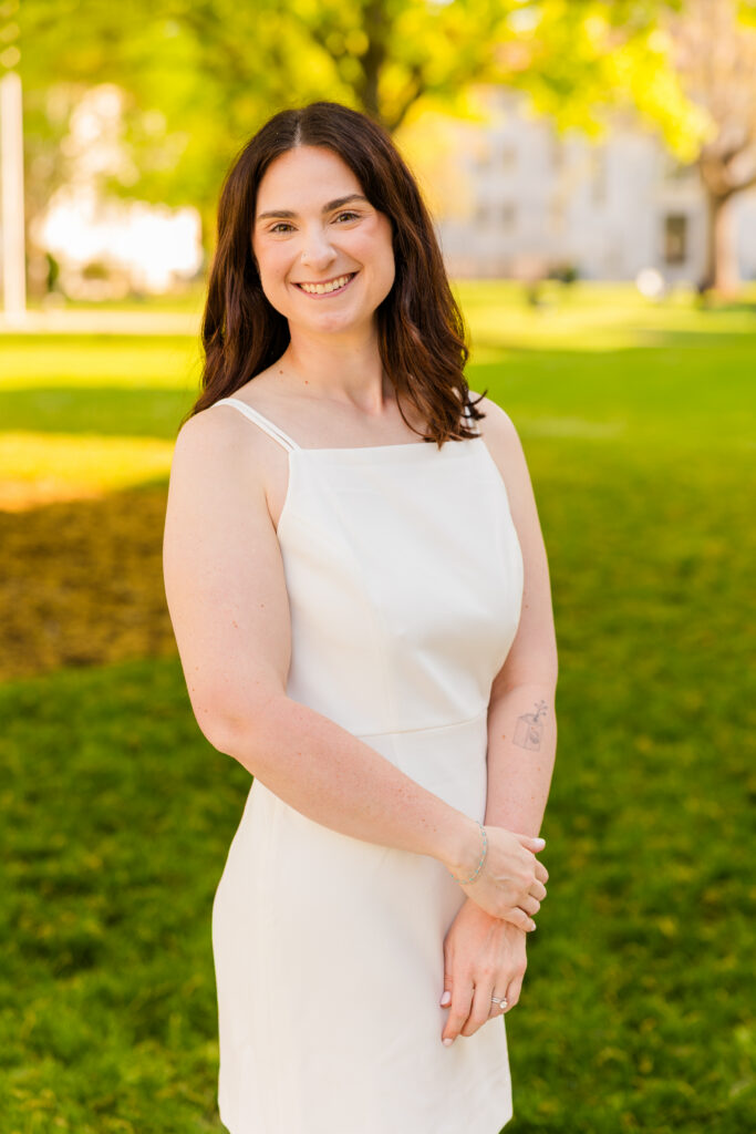 Close up of Roma holding her arm at Emory graduation session