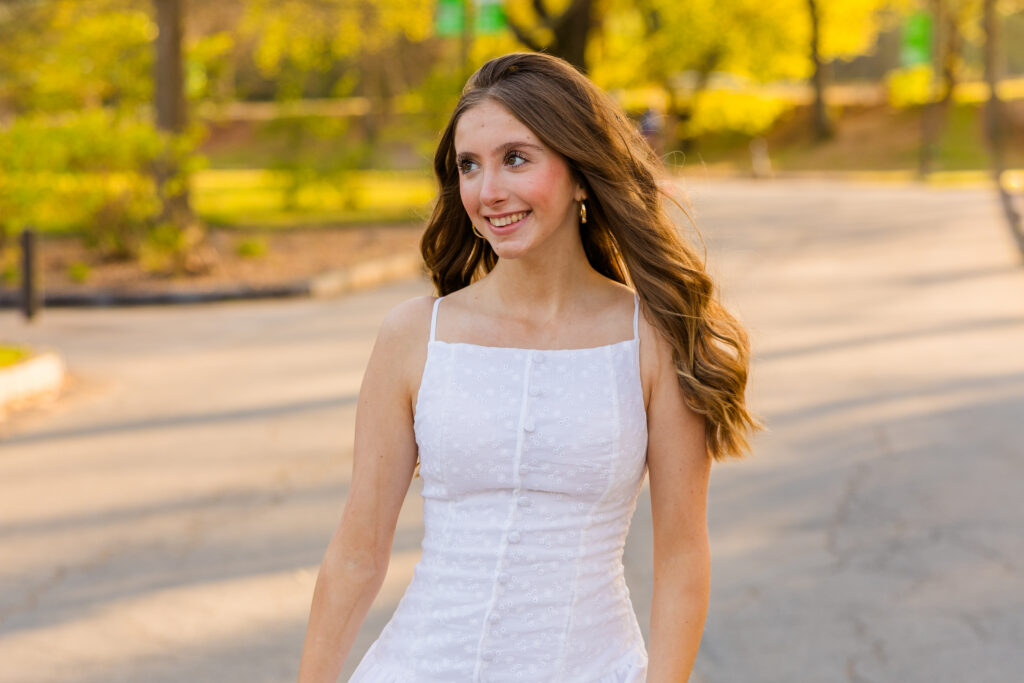 Senior walking and smiling in Piedmont Park Atlanta