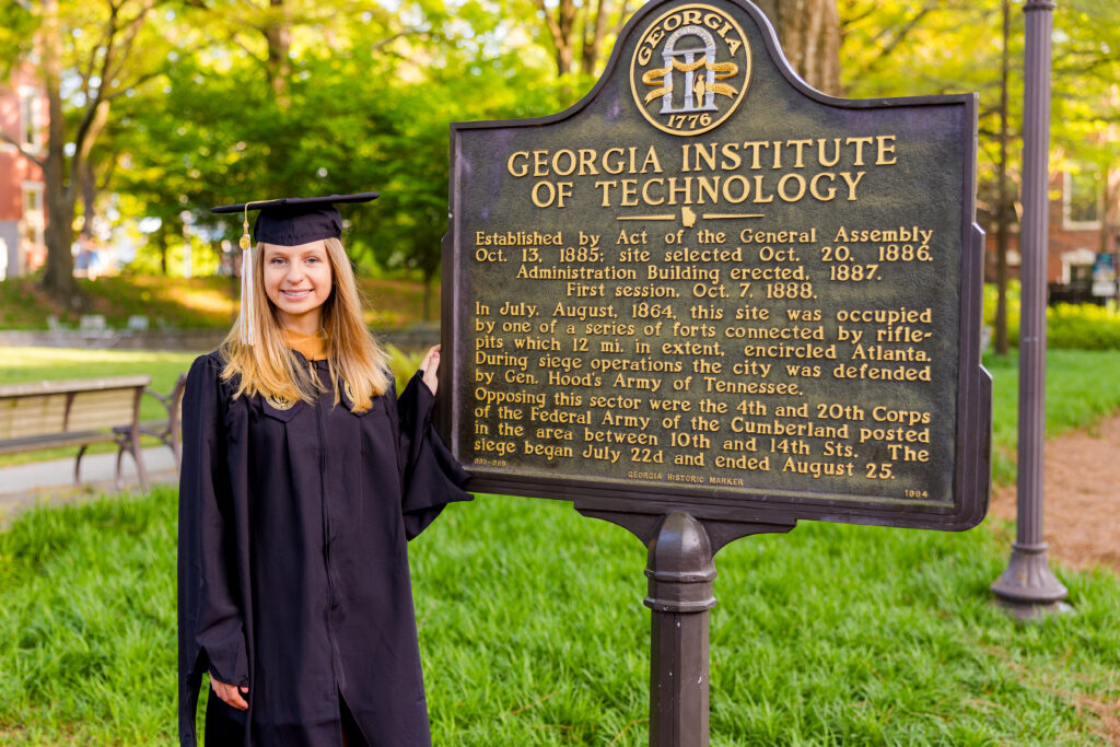 Closer portrait of Gabriela standing at the Georgia Tech sign