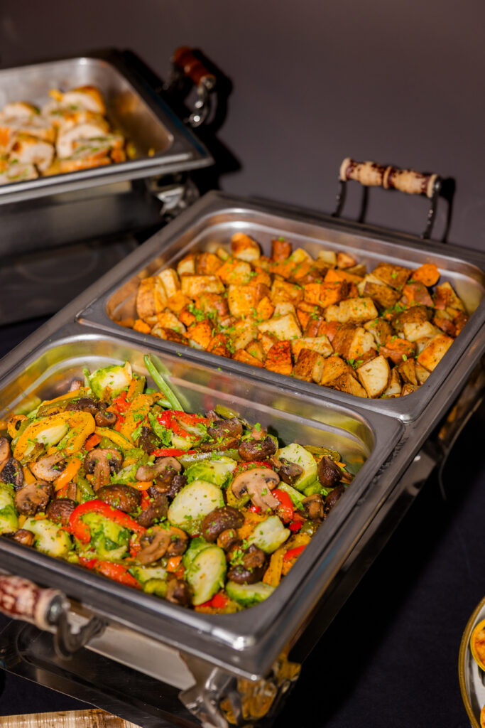 Buffet serving pans with vegetables and side dishes