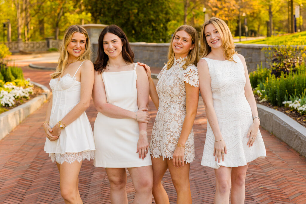 Four girls posing in different fashion poses during Emory graduation session