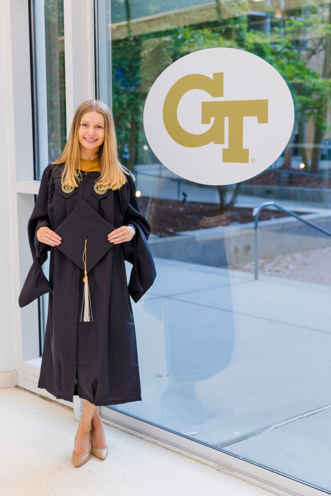 Gabriela standing next to a Georgia Tech sign inside Scheller College of Business
