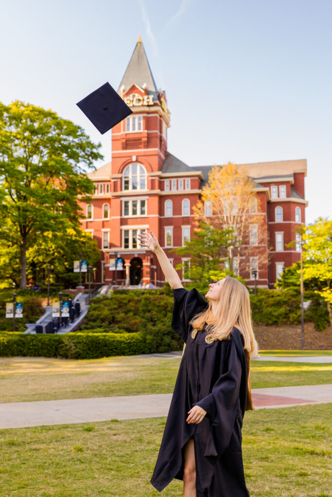 Gabriela tossing her graduation cap in the air at Georgia Tech