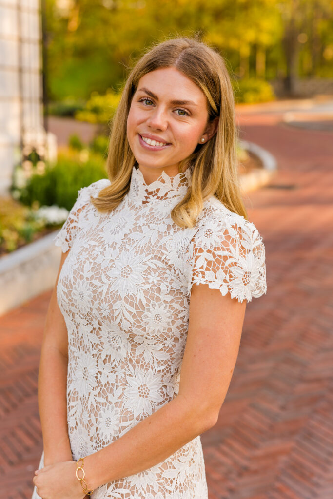 Close up side portrait of McKenzie in a lace white dress at Emory University Atlanta graduation session
