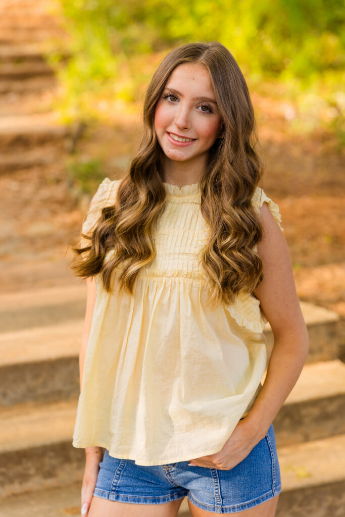 Senior girl posing on stairs at sunset in Piedmont Park Atlanta