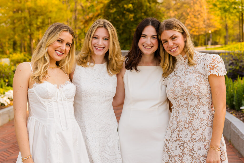 Close up of four girls with heads touching during Emory graduation photos
