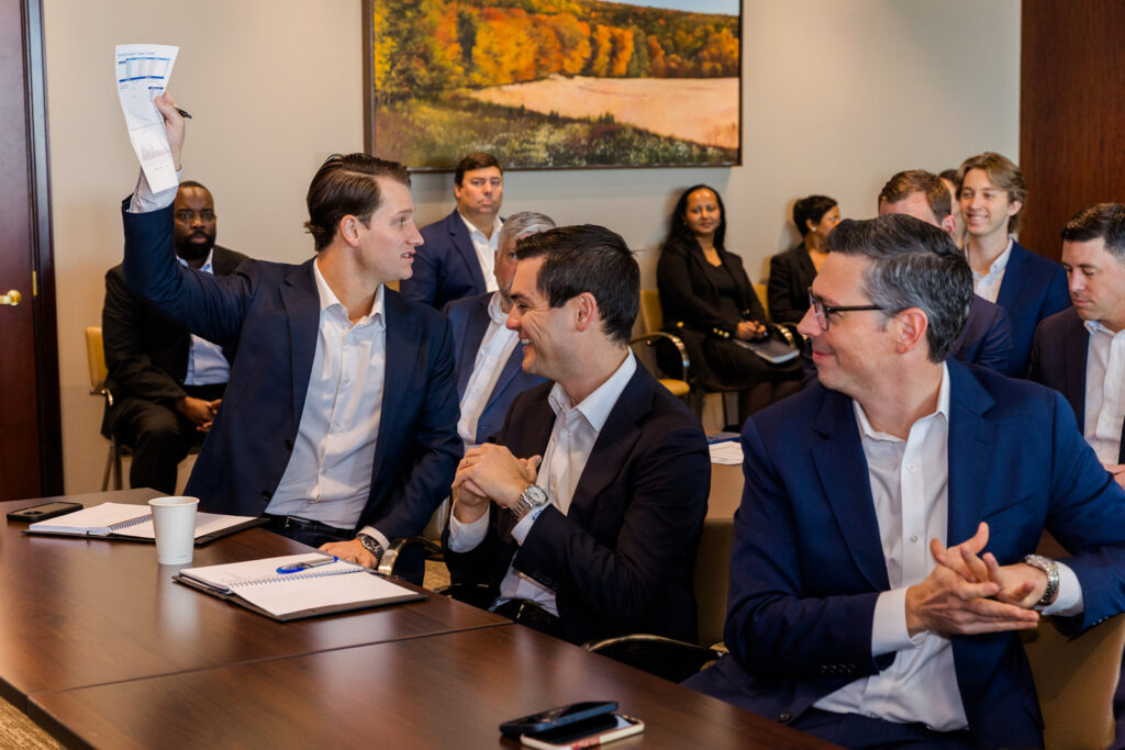 Candid reaction moment during a Merrill Lynch team meeting, Buckhead Atlanta corporate brand photography